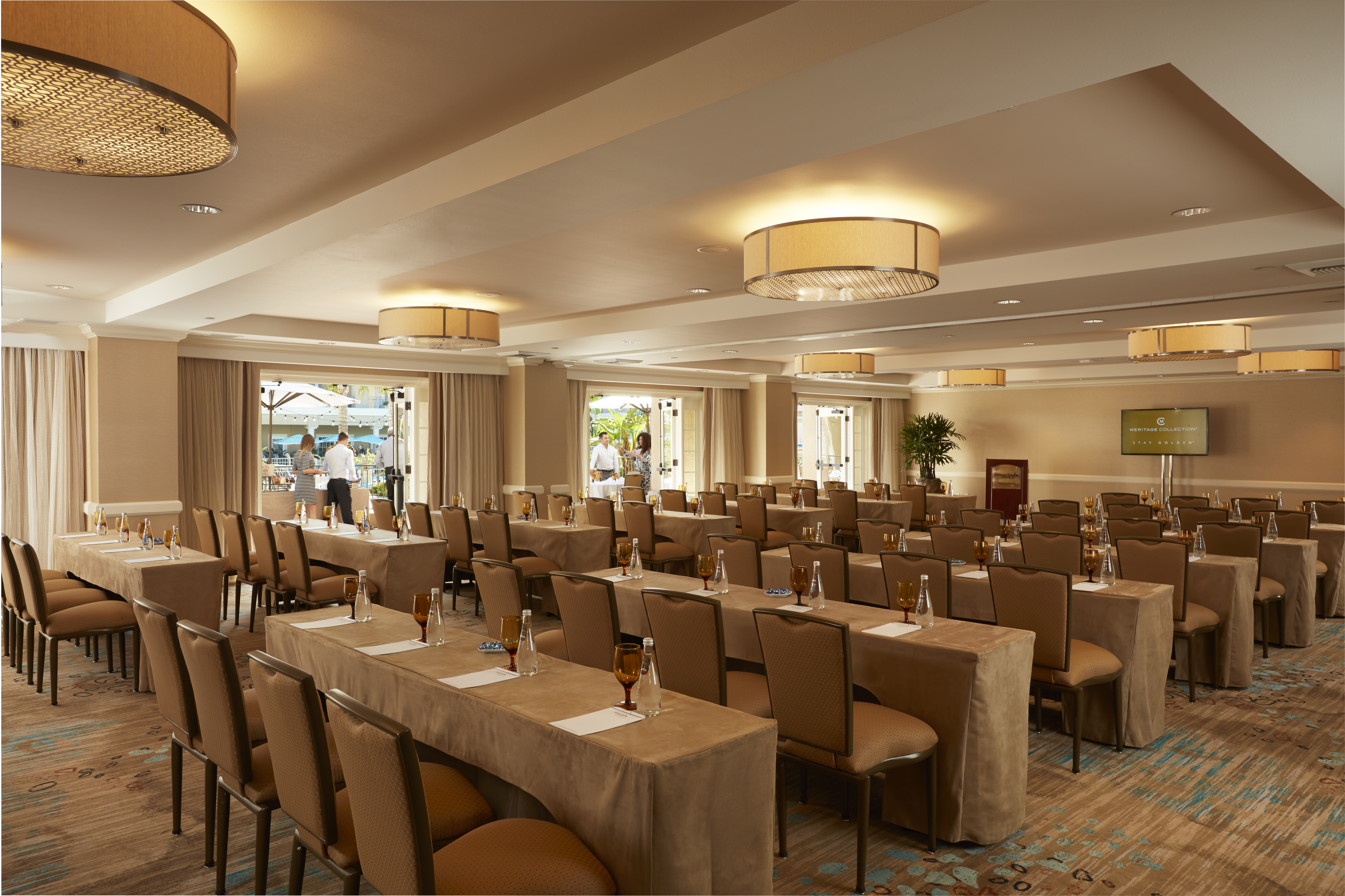 Corporate conference room with rented table linens set for a Houston business event